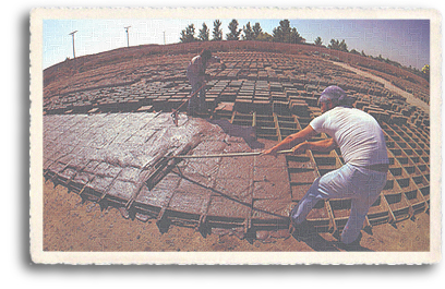 Workers making thousands of adobe bricks for use in modern-day house in Northen New Mexico. Adobe, with its properties of natural heating and cooling, is still one of the most desired forms of construction in the Taos area.