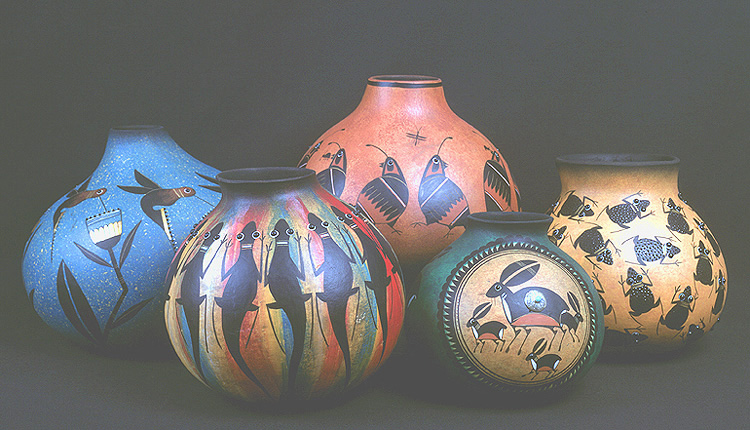 robert rivera gourd decorated with lizards, rabbits, hummingbirds, frogs and quail.
