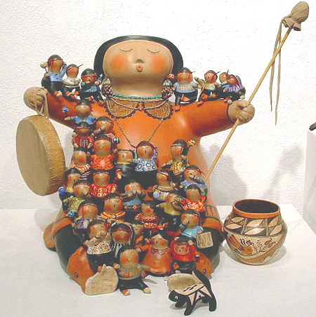 Storyteller on drum with children, gourd art by robert rivera