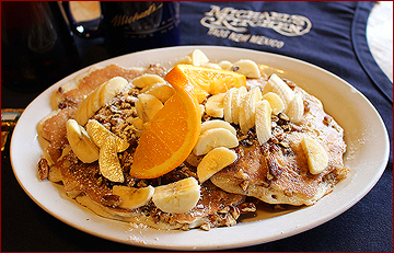 Pecan pancakes with bananas and oranges is a favorite at Michael's Kitchen, where they serve breakfast all day!