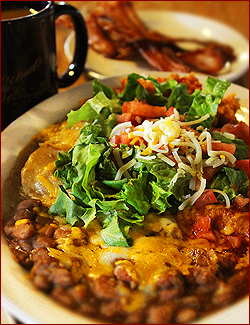 This delicious combination enchilada, burrito and flour taco plate with rice and beans is a work of art!