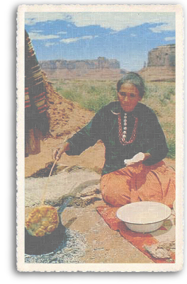 This vintage postcard shows a Native American (Indian) woman cooking fry bread on one of the pueblos in Northern New Mexico. This is one of the favorite foods offered by the vendors each year at Indian Market in Santa Fe, New Mexico.