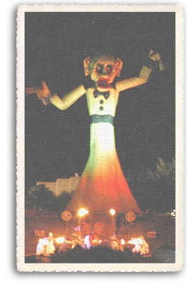 Zozobra is about to start, as the Fire Dancers gather at the base of the 50-foot effigy. The Zozobra event takes places every September in Santa Fe, New Mexico.