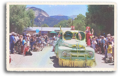 Locals and visitors line up along the main street through Arroyo Seco New Mexico for the annual July 4th parade.
