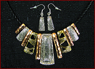 Taos Mountain Candles and gifts carries a line of beautiful jewelry, including this tri color necklace and earring set.